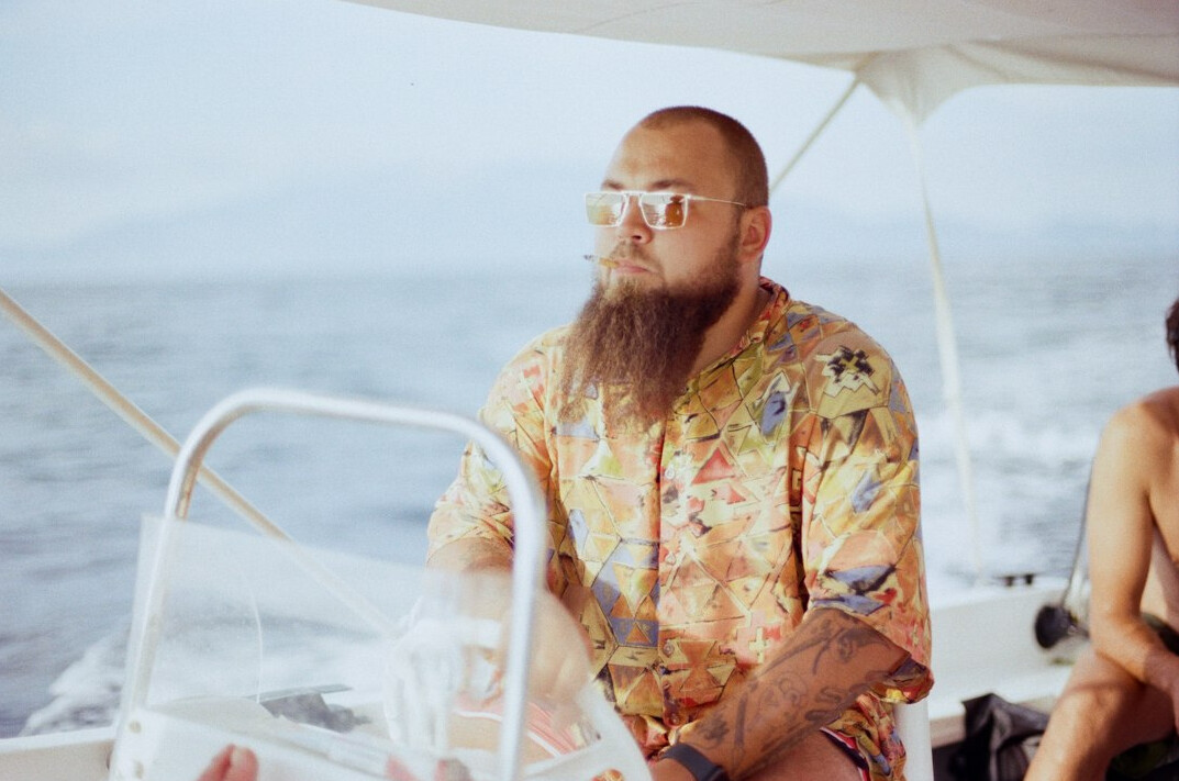 Portrait of a bearded Latin American man in a casual shirt