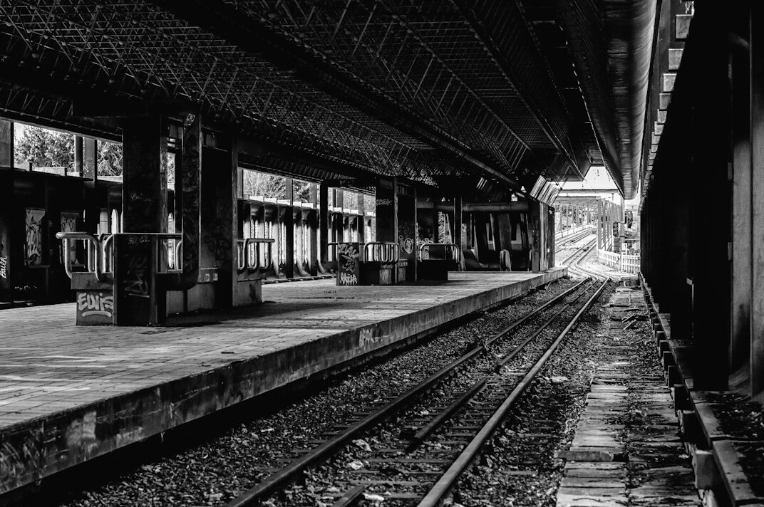 Abandoned railway platform with old tracks